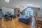 MAIN FLOOR LIVING ROOM AREA WITH FIREPLACE AND GRAND VIEWS OF THE BEAUTIFUL LAKE OF THE OZARKS